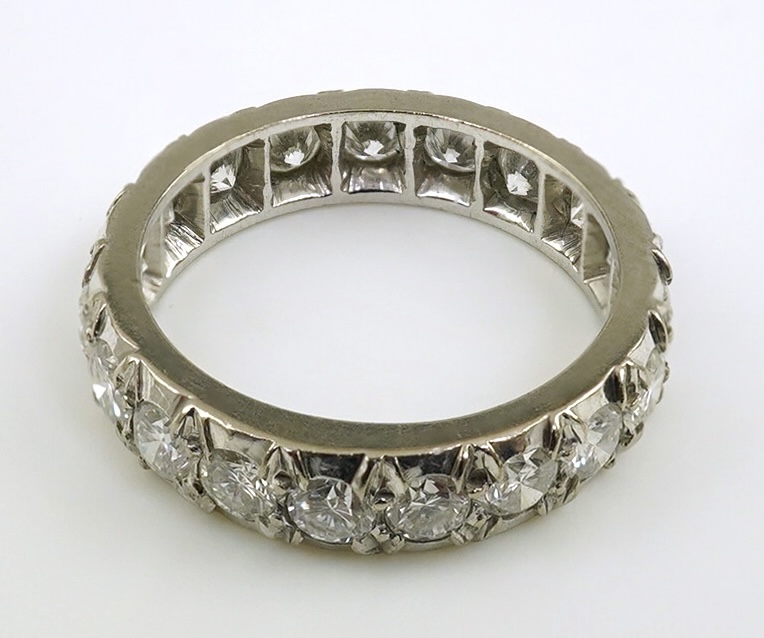 A platinum? and nineteen stone illusion set diamond full eternity ring